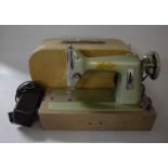 A Vintage Universal 'Zephyr' Electric Sewing Machine