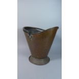 A Hammered Copper Arts and Crafts Influenced Coal Bucket with Loop Handle, 37cms High