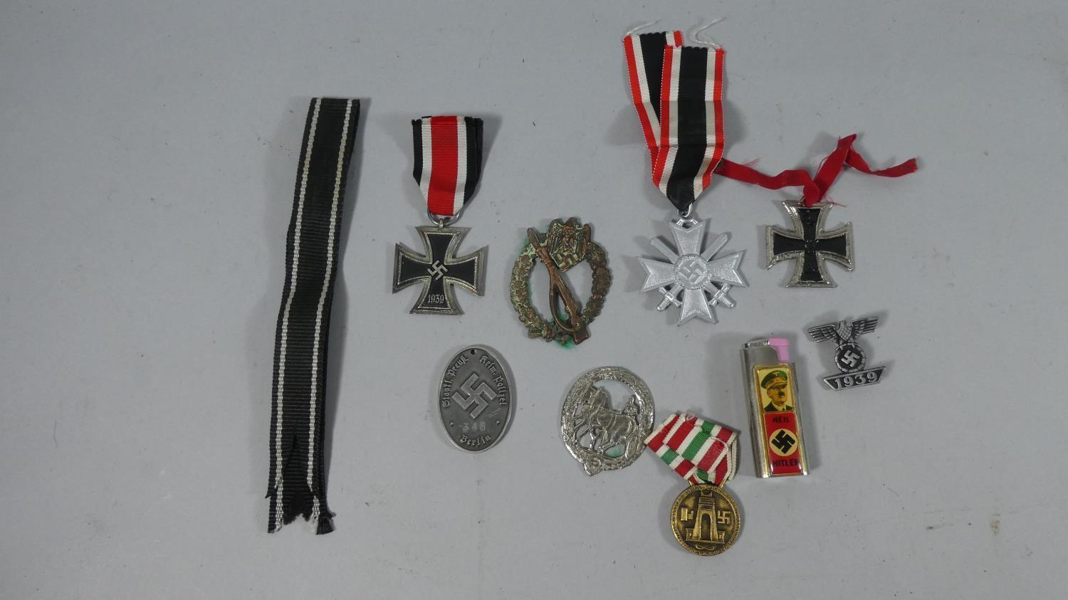 A Collection of Reproduced Nazi Medals, Badges and Tinnies Together with 'Heil Hitler' Lighter (We