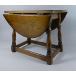 A Small Oak Drop Leaf Table, 50cms Long and 39cms High