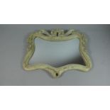 A Small Carved Wooden Framed Mirror, 40cms Wide