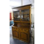 A Modern Oak Dresser, the Base with Three Drawers Over Cupboard, Lead Glazed Top Section with Two