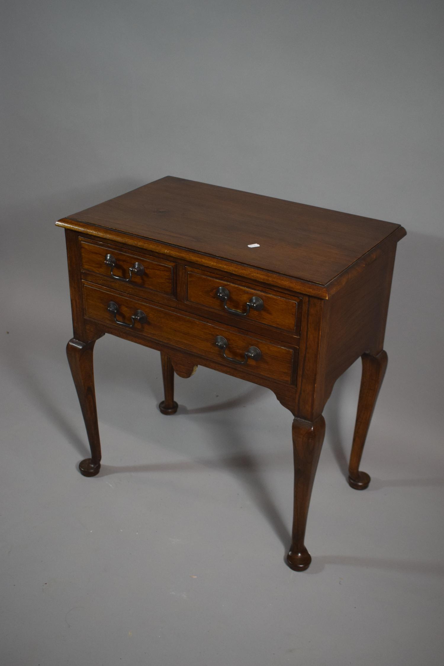A Reproduction Lowboy with Two Short and One Long Drawers, on Cabriole Supports, 68cms Wide - Image 2 of 2