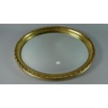 A Gilt Framed Oval Wall Mirror, 55cms High