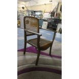 An Edwardian Cane Backed Nursing Armchair