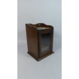 An Edwardian Oak Galleried Smokers Box with Glazed Door to Fitted Interior with Pipe Rack and