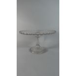 A Moulded and Pressed Glass Cake Stand, 31cms Diameter and 18cms High