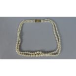 A Double String of Pearls with 9 Carat Gold Clasp