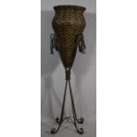 A Modern Wrought Iron and Wicker Planter of Amphora Form with Swags, 102.5cms High