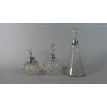 Three Silver Topped Glass Scent Bottles with Stoppers, London 1910, B'ham 1905, London 1918