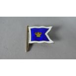 An Enamelled Silver Brooch in the Form of a White Bordered Blue Flag with Central Crown, Stamped