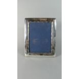 A Rectangular Silver Photo Frame with Easel Back, B'Ham 1997, 25.5 x 20.5cms