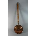 A 19th Century Copper Bed Warming Pan with Turned Wooden Handle