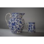 A Blue and White Transfer Decorated Burleigh Ware Water Jug, 19cms High Together with a Smaller