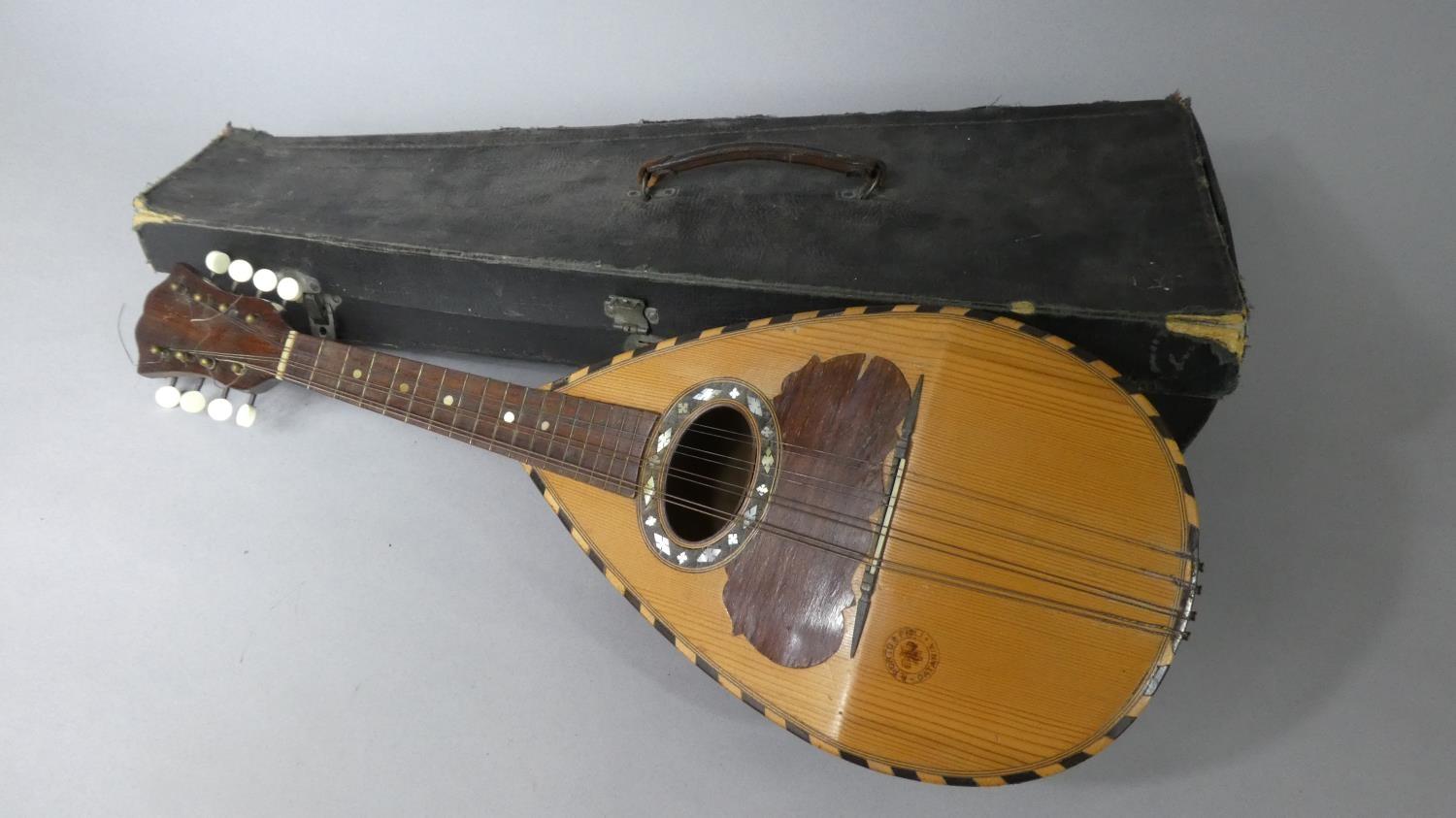 An Italian Cased Mandolin Stamped 'R. Porto + Figli Catania'