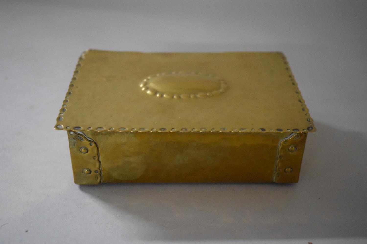 An Early 20th Century Hand Beaten Brass Cigarette Box with Banded Rivet Decoration, Makers Stamp - Image 2 of 3