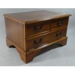 A Yew Wood TV and DVD Stand in the Form of a Two Drawer Chest, 63cms Wide