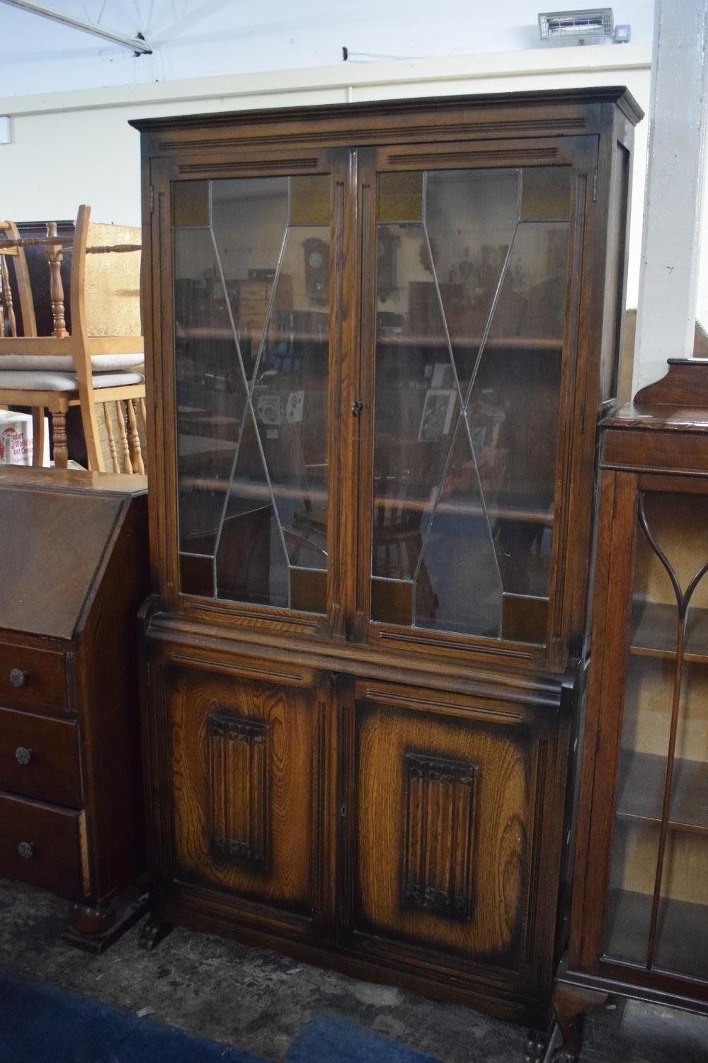 A Mid 20th Century Oak Linenfold Bookcase (One Glass Pane Cracked), 91cms Wide