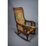 A Late Victorian Mahogany and Walnut Framed Scroll Arm Rocking Chair