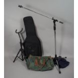 A Modern Adjustable Microphone Stand, a Guitar Stand, a Fender Guitar Bag and a Holdall