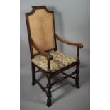 An Edwardian Cane Seated and Backed Scroll Armchair