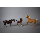 A Beswick Palomino, Comical Foal and Brown Mare