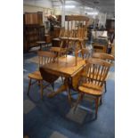 A Pine Drop Leaf Kitchen Table And Six Matching Chairs, 92cms Wide