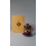 A Boxed Chinese Ceramic Teacup, Strainer & Saucer Set