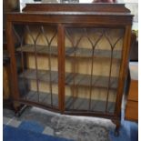 An Edwardian Galleried Oak Serpentine Front Display Cabinet, 120cms Wide