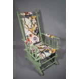 An Early 20th Century Painted and Reupholstered American Rocking Chair with Spare Fabric