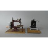 A Vintage Rolling Press Mounted on Wooden Plinth Together with a Small Childs Sewing Machine