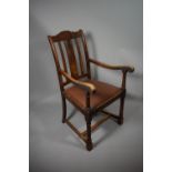 An Edwardian Oak Framed Armchair