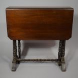 An Edwardian Mahogany Sutherland Table with Turned Supports and Stretcher, 60cms Wide