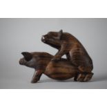 A Carved Wooden Study of Pigs Fornicating, 16cms Wide