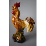 A Continental Glazed Terracotta Study of a Cockerel, 31cms High