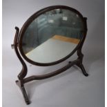 An Edwardian Mahogany Framed Oval Dressing Table Mirror, 51cms Wide