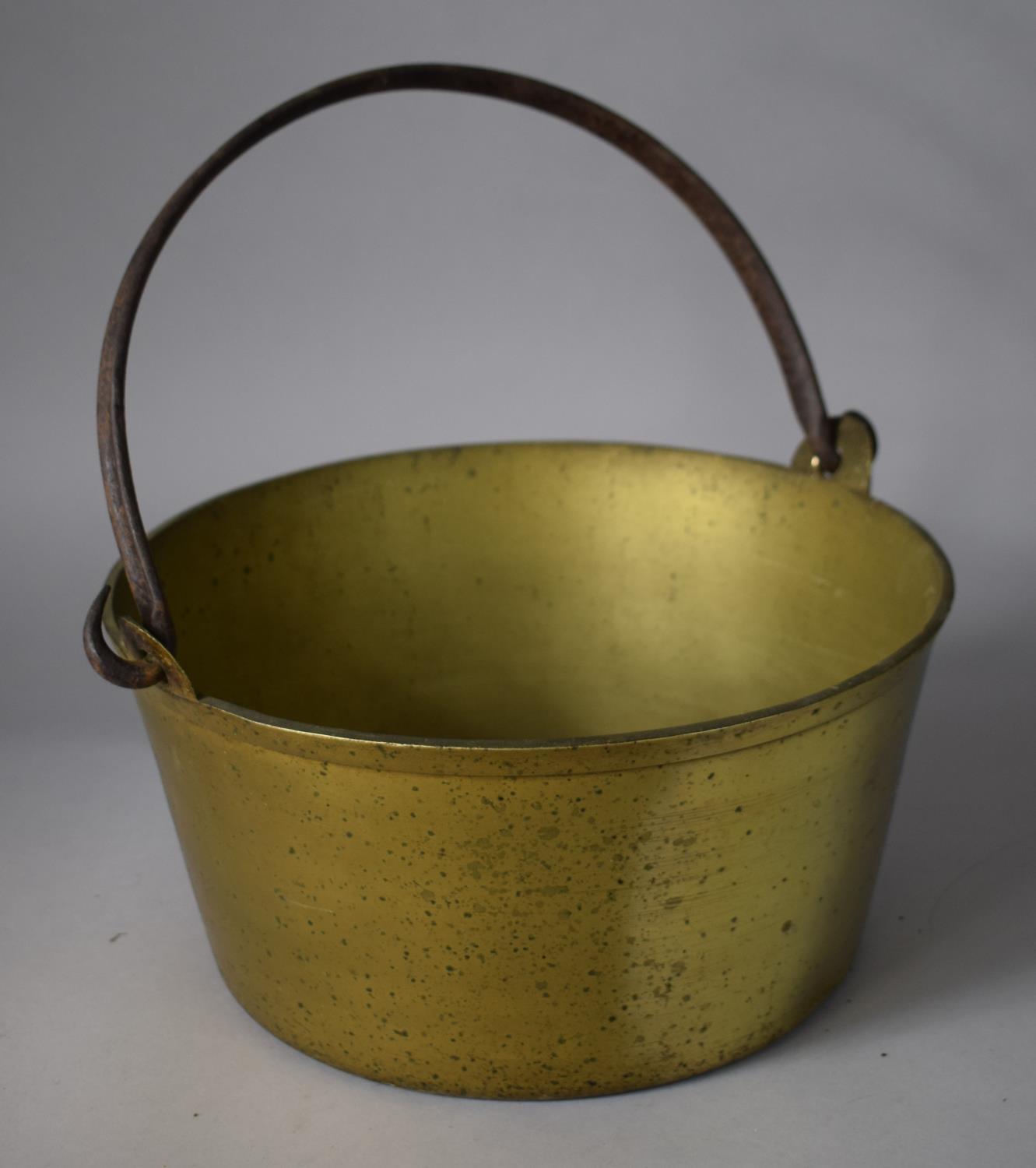 A Heavy Brass Jam Pan with Iron Loop Handle, 33cms Diameter