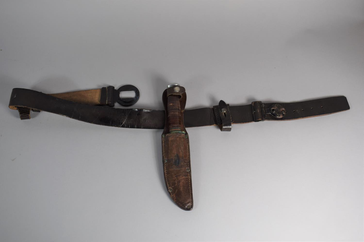 A Boy Scouts Leather Belt and a William Rogers Bowie Knife 'I Cut My Way' with Leather Sheath