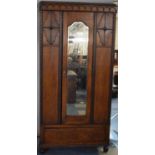An Edwardian Oak Mirror Fronted Wardrobe with Base Drawer, 91cms Wide