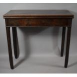 A 19th Century Mahogany Lift Top Games Table, 81cms Wide