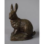 A Bronzed Resin Study of a Seated Hare, 11cms High