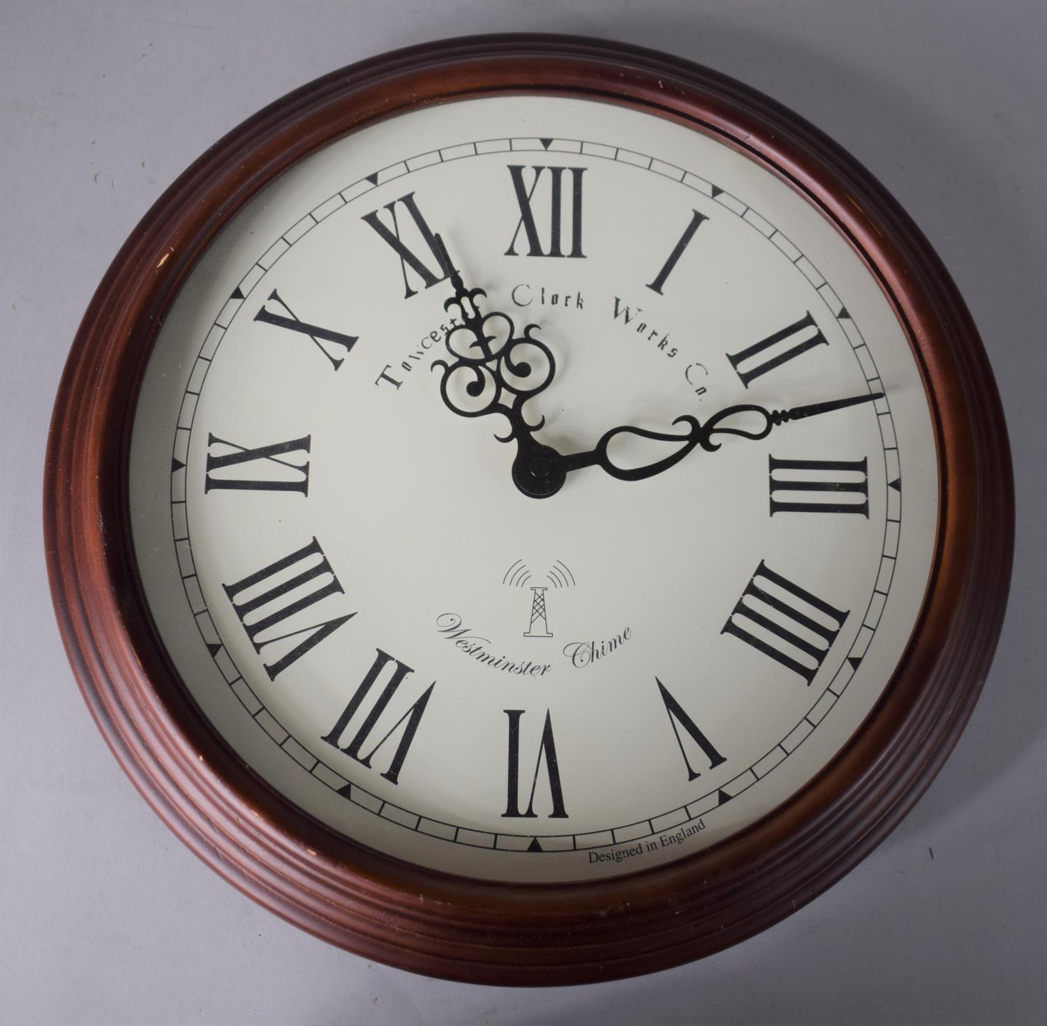 A Circular Battery Operated Westminster Chime Wall Clock, 35cms Diameter