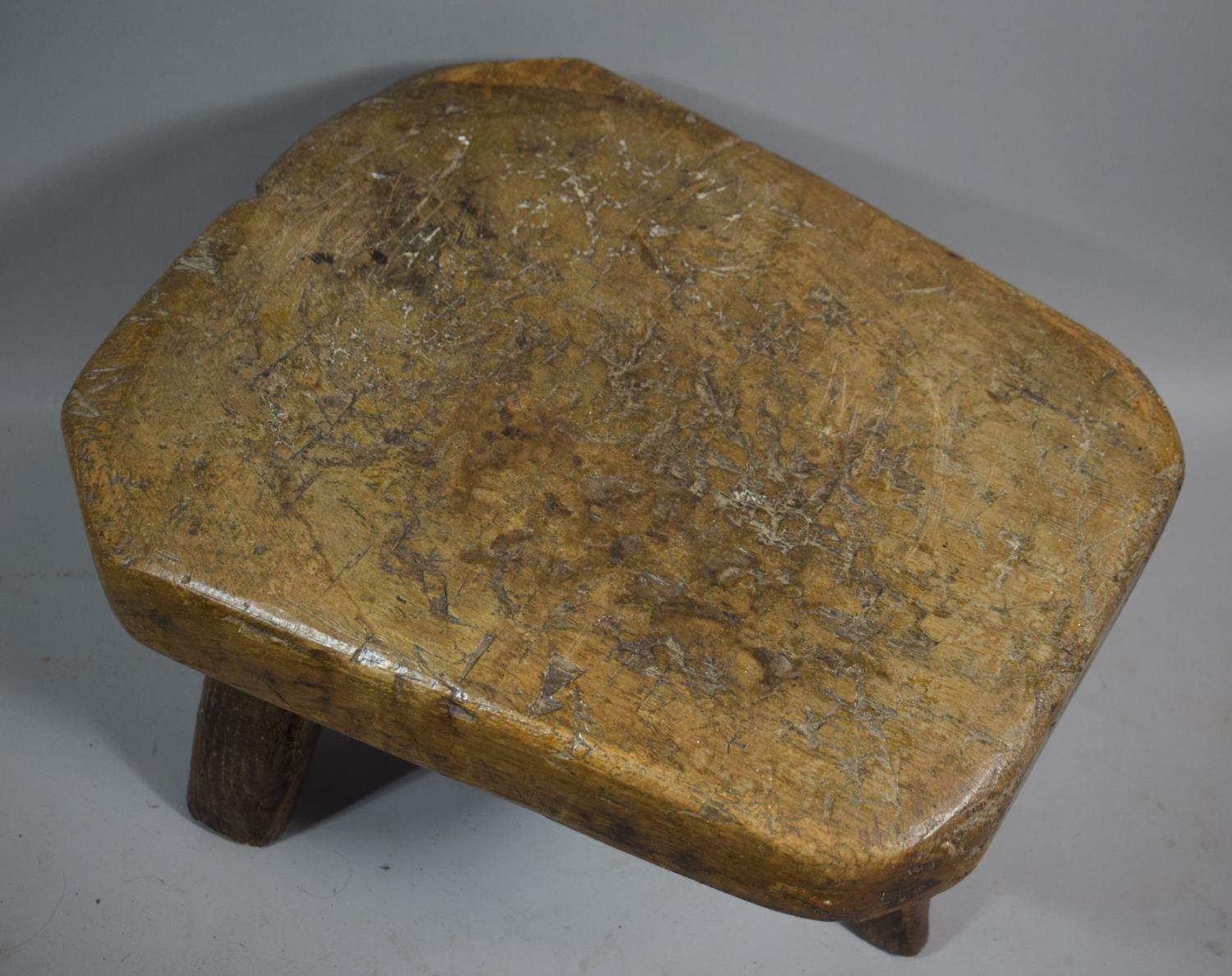 An Early 19th Century Heavy Elm Topped Three Legged Pig Bench Stool, 55cms Long - Image 2 of 2