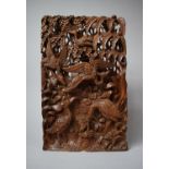 An Indonesian/Balinese Intricately Carved Kepeian Wood Panel with Hornbill Decoration, 23 x 38cms