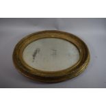 A Gilt Framed Oval Wall Mirror (AF), 57cms Wide