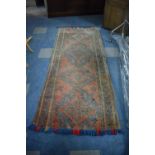 A Patterned Woollen Rug, 2.5m x 99cms