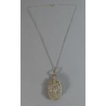 A Silver Filigree Locket and Chain Decorated in Relief with Ships Anchor