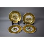 A Collection of Four Decorated Plates with Gilt Borders