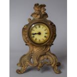 A French Gilt Metal Mantel Clock with Moulded and Pierced Decoration, 16cms High