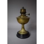A Late 19th Century Oil Lamp by Veritas Lamp Works Co. with Brass Reservoir and Stand Mounted on